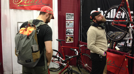 booth-at-nahbs-trade-show-bicycle-IRIDE-scene-Pic915-load-in-at-north-american-handmade-bicycle-nahbs-chris-king-gates-belt-drive-brooks-conti